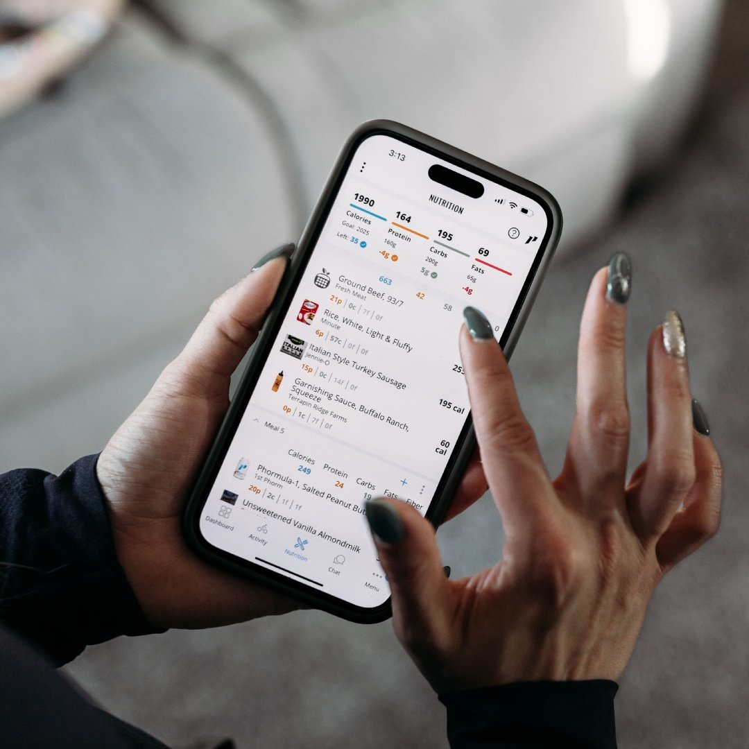 Person using a nutrition tracking app on a smartphone.